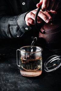 Steeping red tea in glass mug