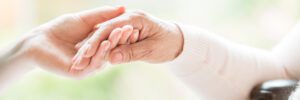 Close up,Of,Tender,Gesture,Between,Two,Generations.,Young,Woman,Holding