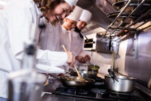 Group,Of,Chef,Preparing,Food,In,The,Kitchen,Of,A