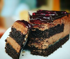 4674823610Chocolate cake with raspberry sauce Cut in two pieces