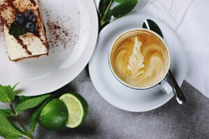 495364298Latte with design tiramisu limes white plates