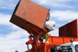 Workers,Load,Garbage,From,The,Tank,In,A,Specialized,Car
