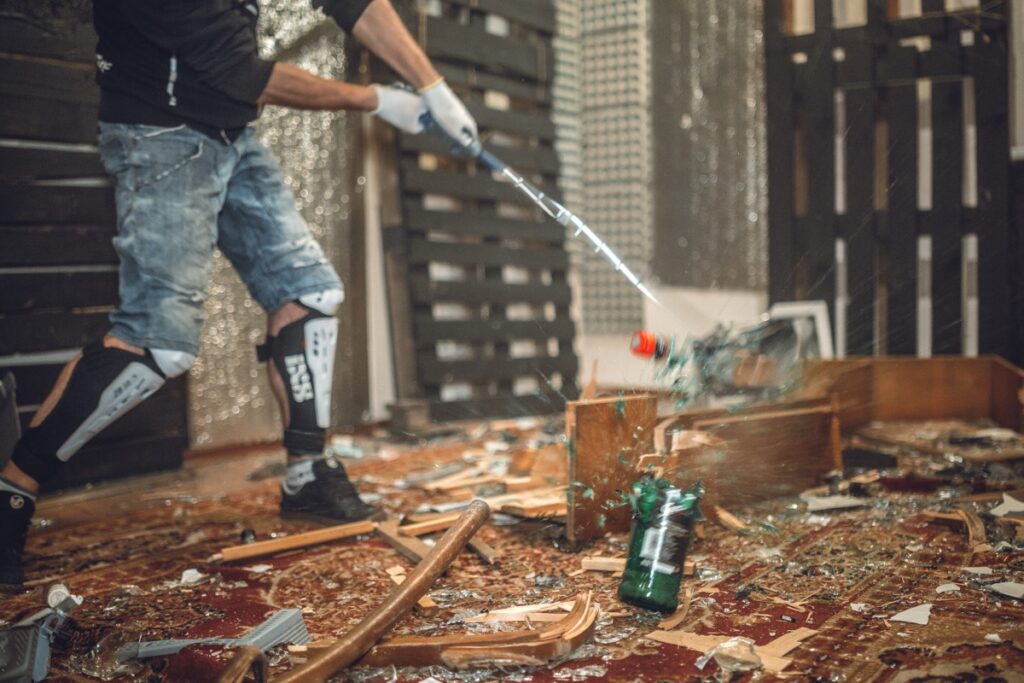 A,Man,Smashing,The,Bottle,With,Golf,Club