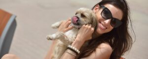 happy young woman with puppy have fun