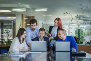 people with laptops office